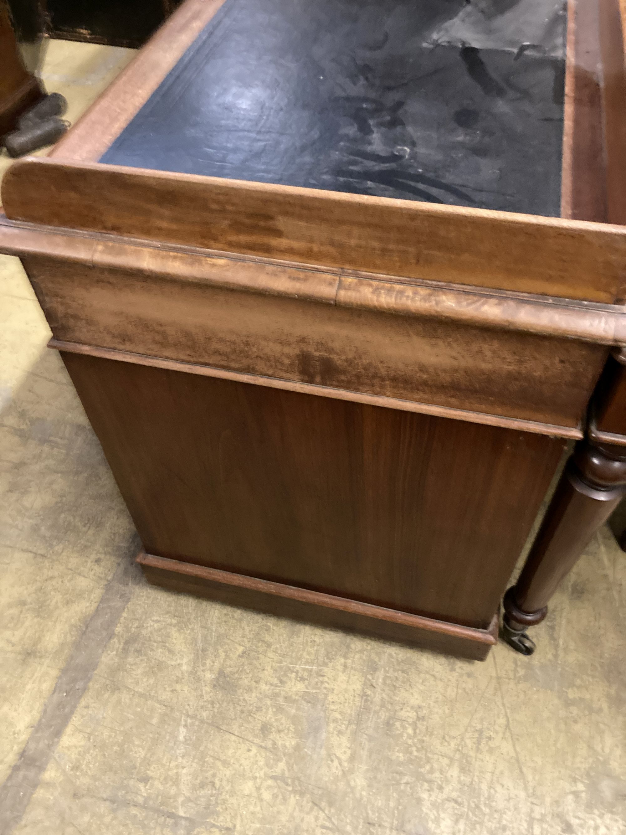 A Victorian mahogany pedestal desk, with a three quarter gallery top, width 122cm, depth 60cm, height 83cm